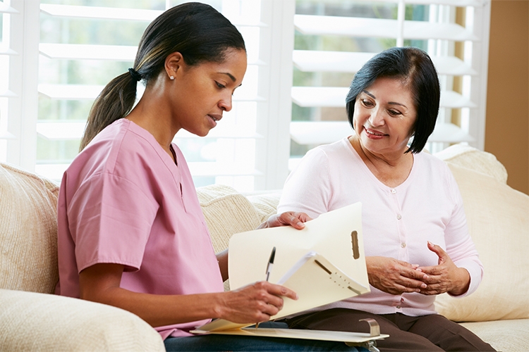 A nurse working with a patient.